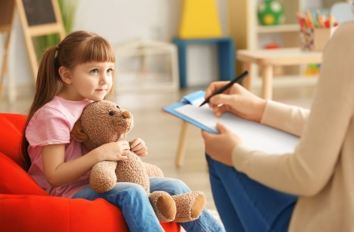 Child talking to an adult and getting early help.