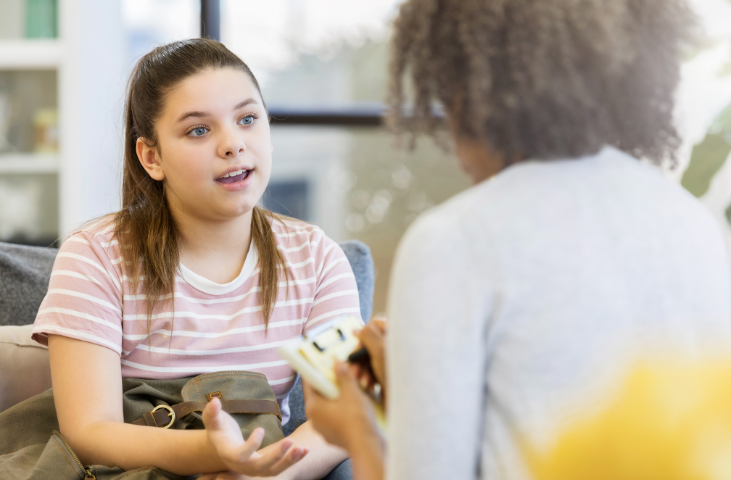 A child talking to an adult