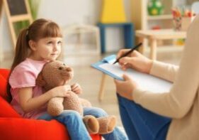 Child talking to an adult and getting early help.