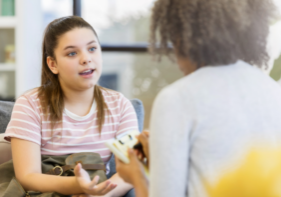 A child talking to an adult