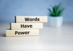 A graphic that are words on blocks that say Words Have Power